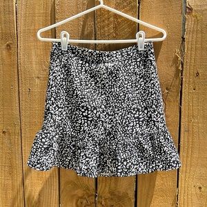 Black and white printed mini skirt with flounce hem and built-in shorts